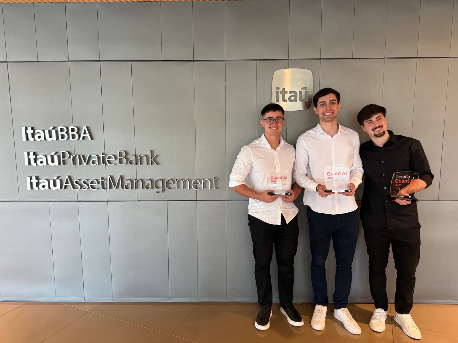 Me and my KernelNet teammates holding our Quant AI 2025 trophies at Itaú Asset Management
