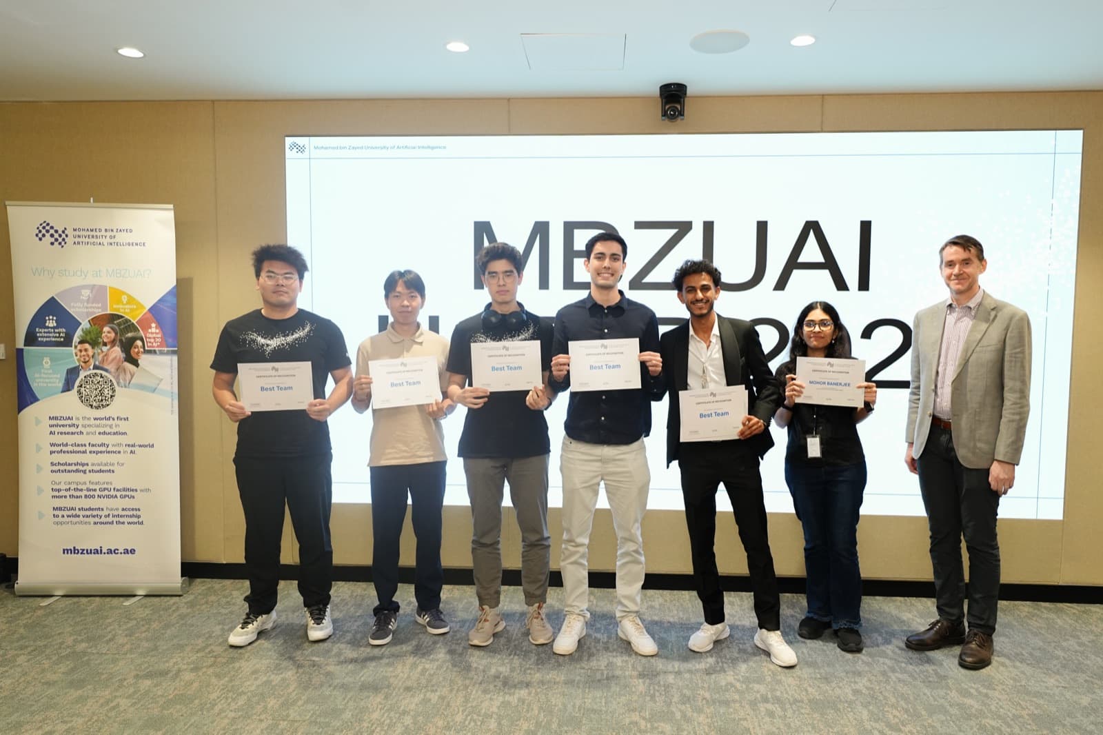 Me and my UGRIP team holding our Best Team Award certificates at MBZUAI