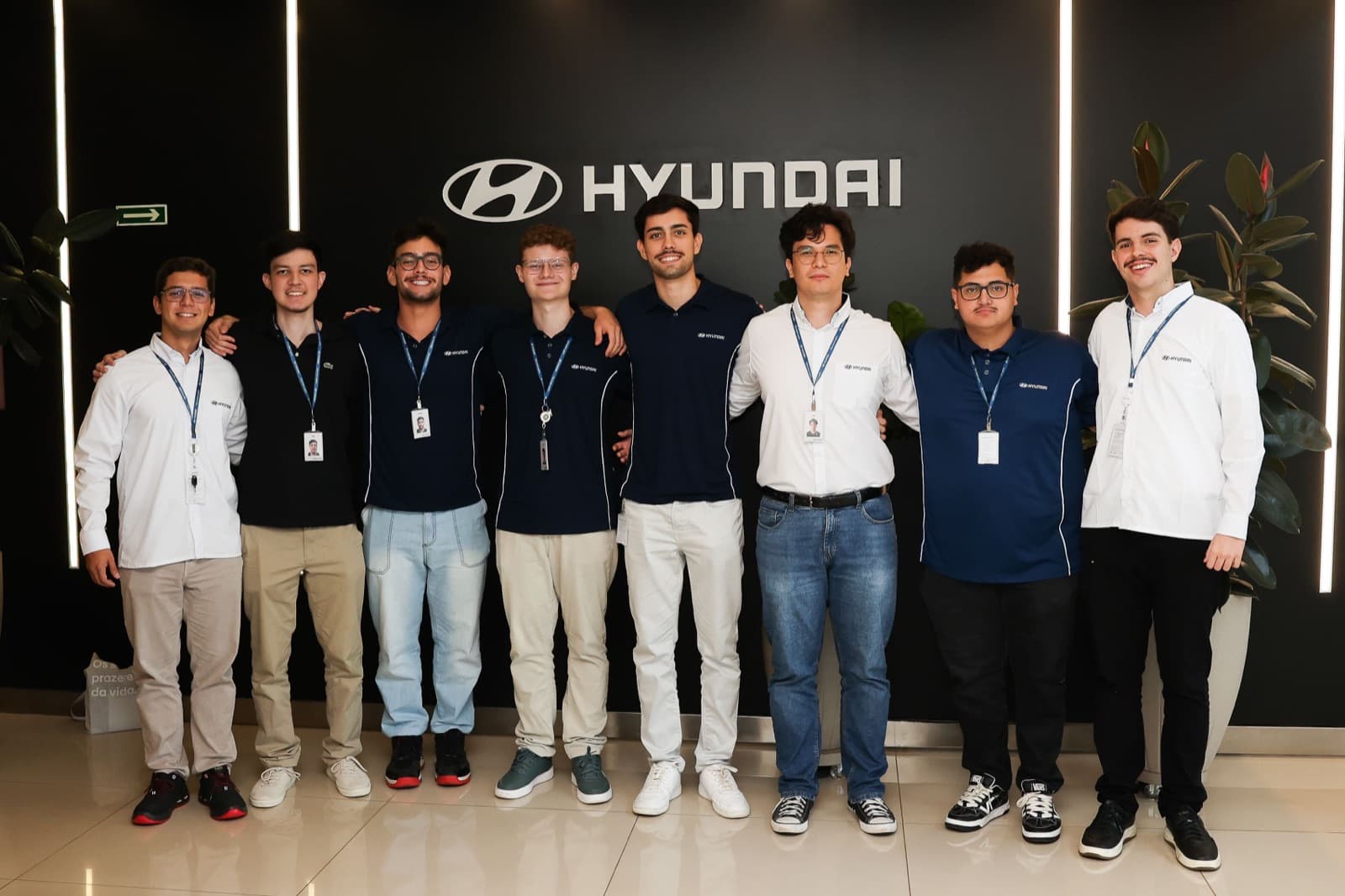Me with the other Hyundai summer interns in front of the Hyundai logo